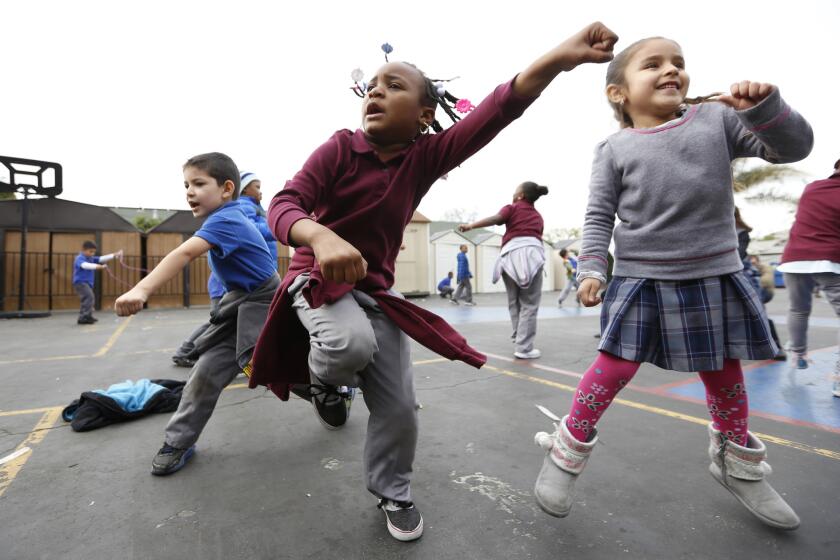 Students at Children of Promise Preparatory Academy in Inglewood dance to honor their music teacher, Benny Golbin, after he was killed in a car crash.