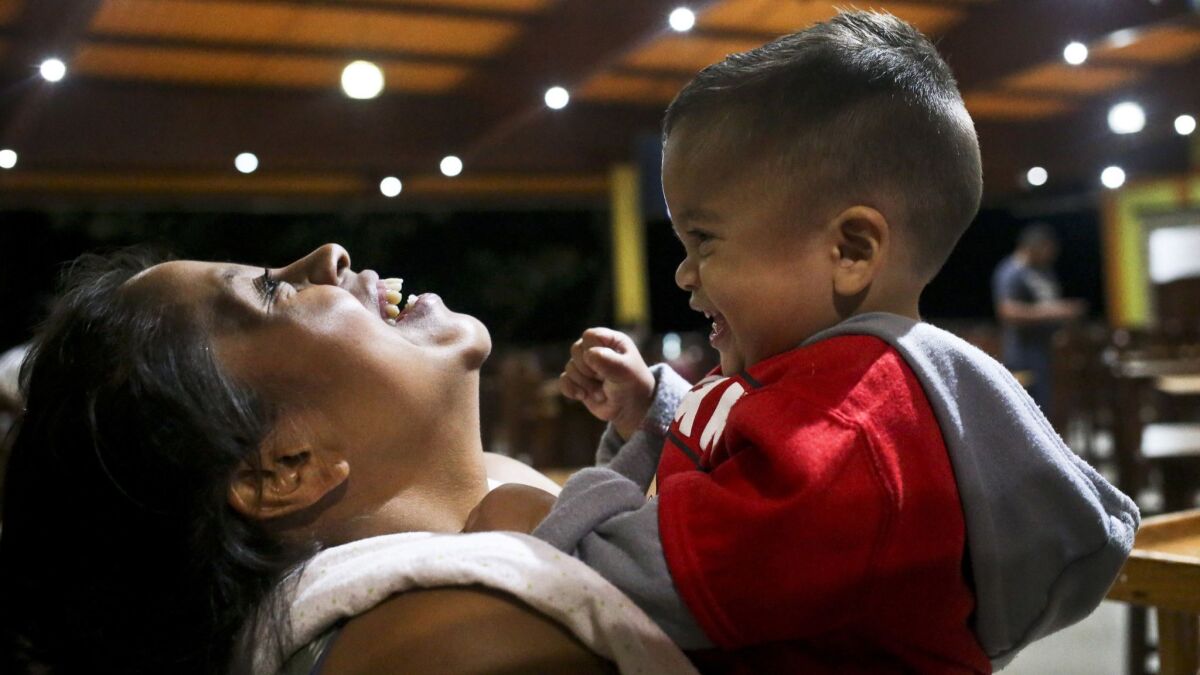 Adalicia Montecinos holds her year-old son Johan, who became a poster child for the U.S. policy of separating immigrants and their children, at a restaurant in Yojoa, Honduras, Friday, 20, 2018.