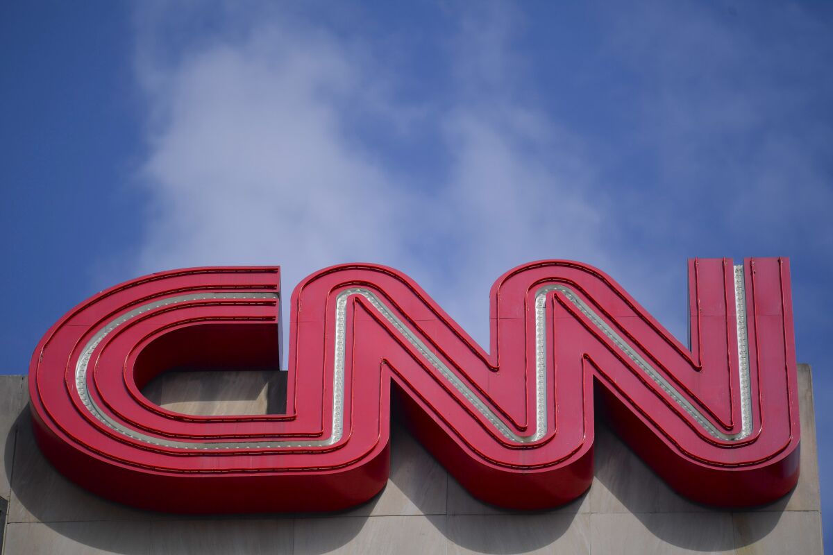 Signage is seen at CNN center, Thursday, April 21, 2022, in Atlanta. Warner Bros. Discovery, which went public in April, missed Wall Street’s expectations in the second quarter, Friday, Aug. 5, as the media giant looks to work through the growing pains of its merger. (AP Photo/Mike Stewart, File)