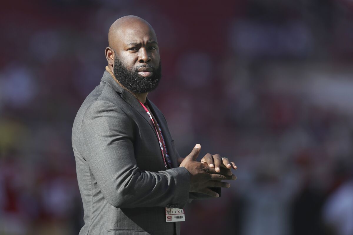 San Francisco 49ers director of personnel Ran Carthon stands on the field at Levi's Stadium.