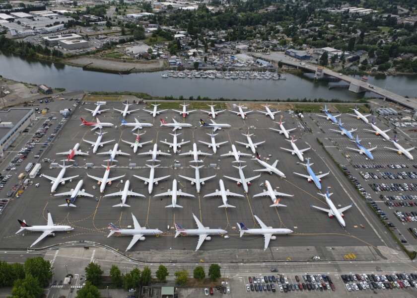 Grounded Boeing 737 Max planes are stored on employee parking lots near Boeing Field on June 27, 2019, in Seattle. 