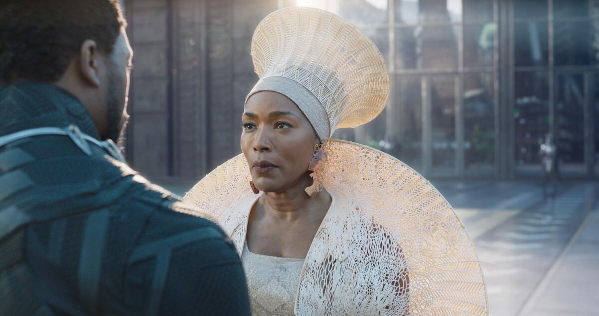 Chadwick Boseman and Angela Bassett in a scene from "Black Panther."