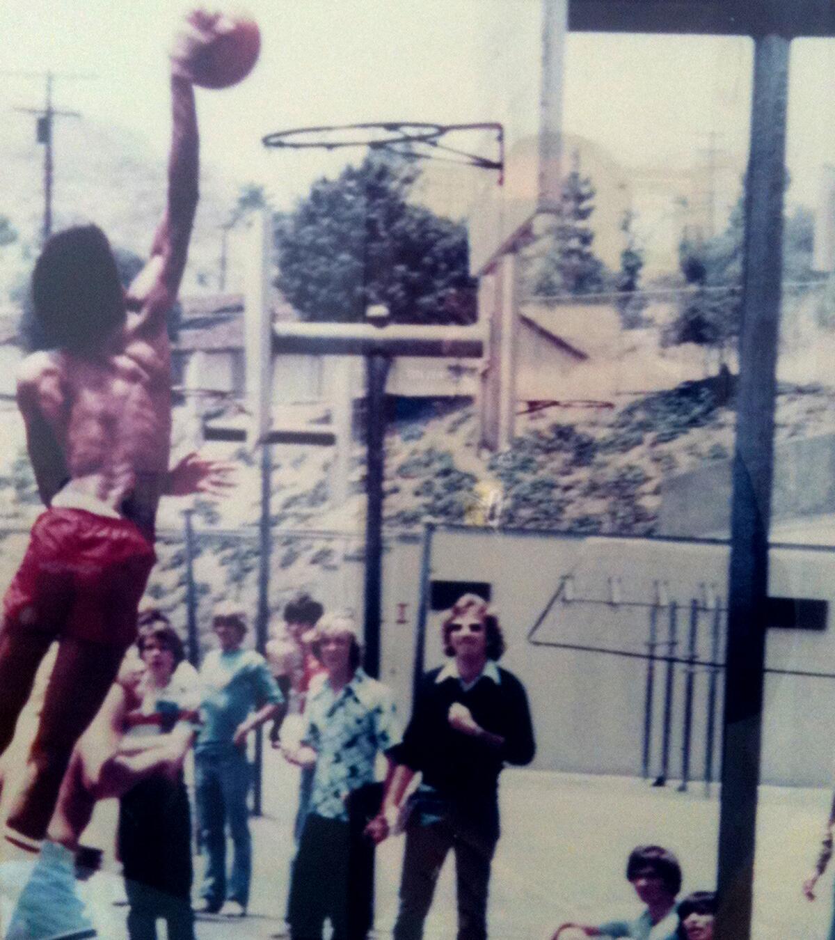 Rod Miller dunks during a pickup game while a student at Taft High.
