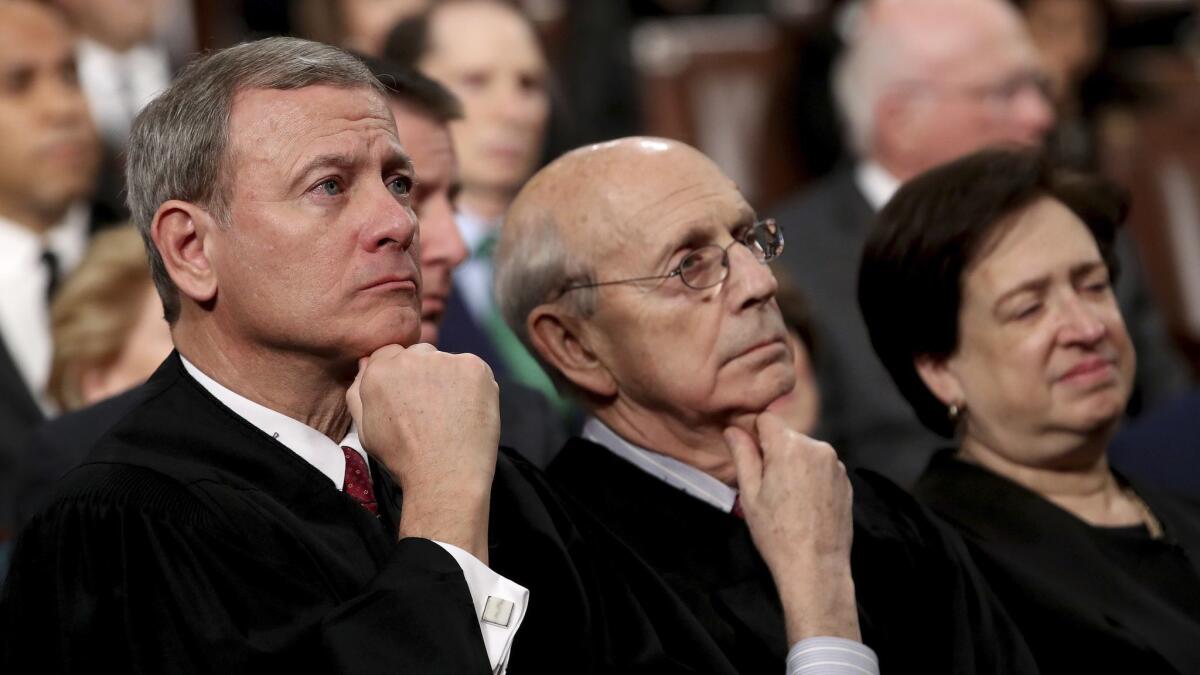 U.S. Supreme Court Chief Justice John Roberts, from left, Associate Justice Stephen Breyer, and Associate Justice Elena Kagan listen to President Trump's State of the Union address in the U.S. Capitol on Jan. 30.