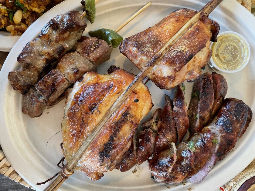 Assortment of grilled meats and skewers
