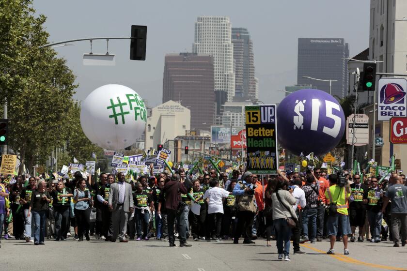 Fight for 15 protestors march down Figueroa Street in Los Angeles on their way to USC.