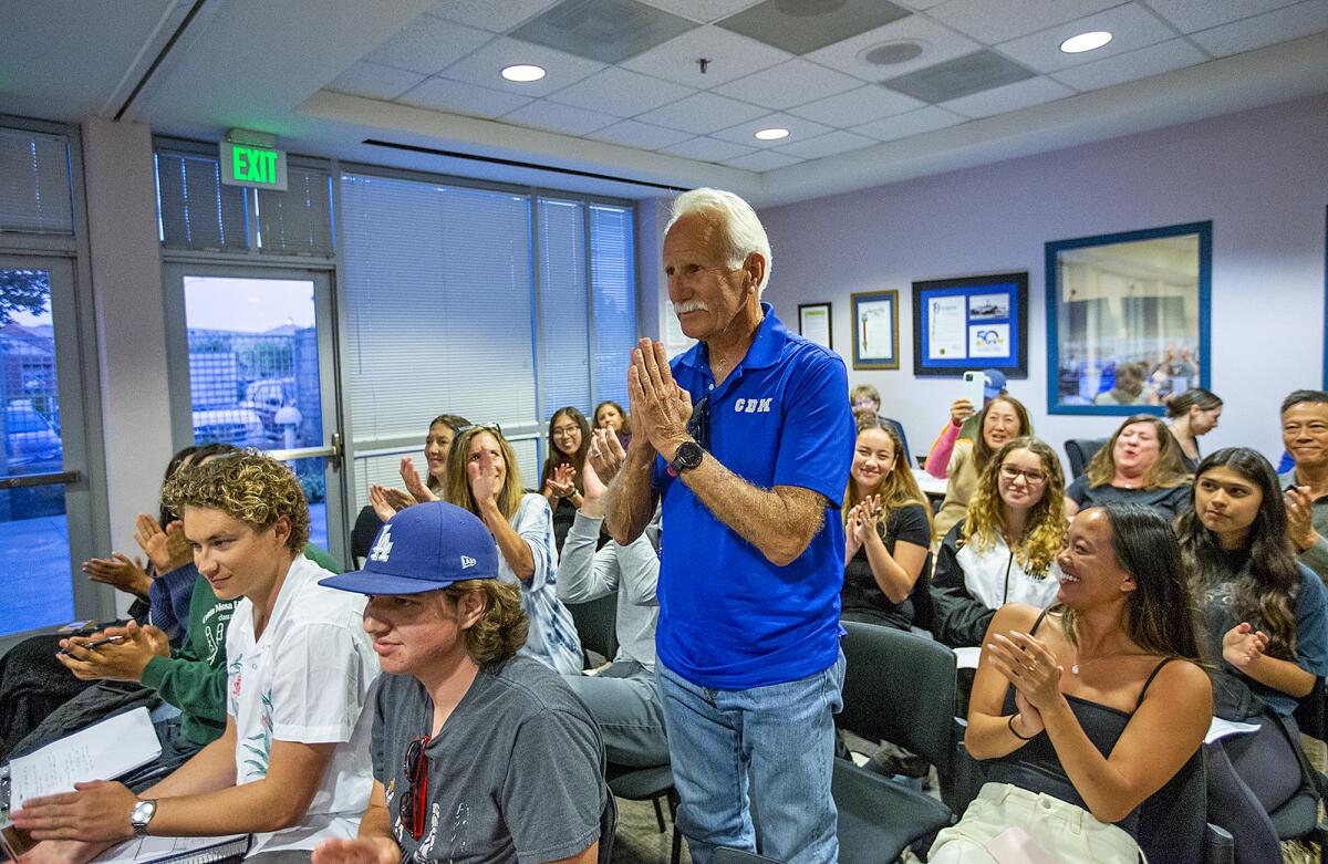 Bill Sumner, the Corona del Mar High School cross-country and track and field coach, stands during a meeting on Tuesday.