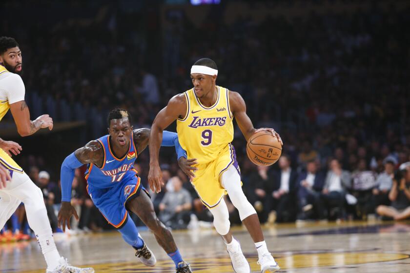 Los Angeles Lakers' Rajon Rondo (9) drives past Oklahoma City Thunder's Dennis Schroder (17) during the first half of an NBA basketball game, Tuesday, Nov. 19, 2019, in Los Angeles. (AP Photo/Ringo H.W. Chiu)