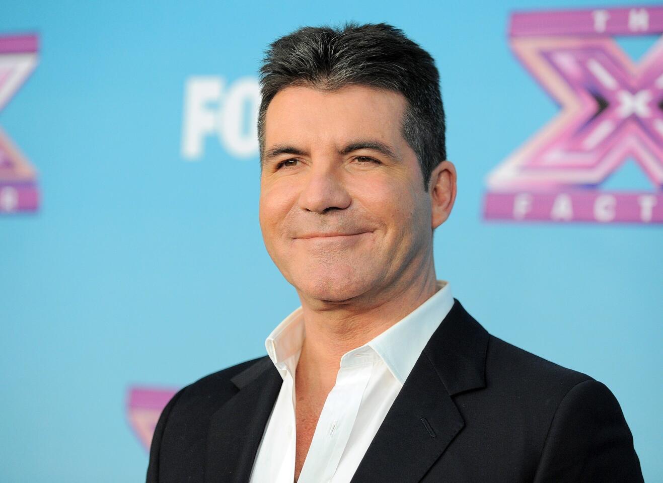 Simon Cowell gets egged on live television