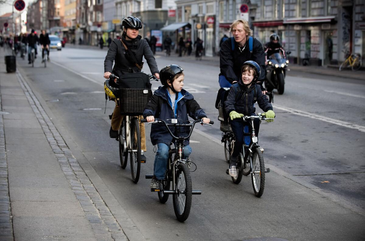 A Danish family rides along a bicycle path in central Copenhagen in 2009.