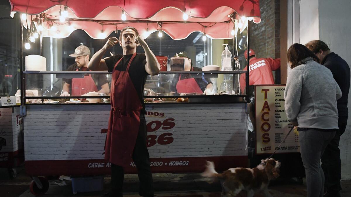 Tacos 1986 co-owner Jorge Alvarez-Tostado stands outside of the taco stand in January. He and partner Victor Delgado will open a restaurant in downtown L.A. in June.