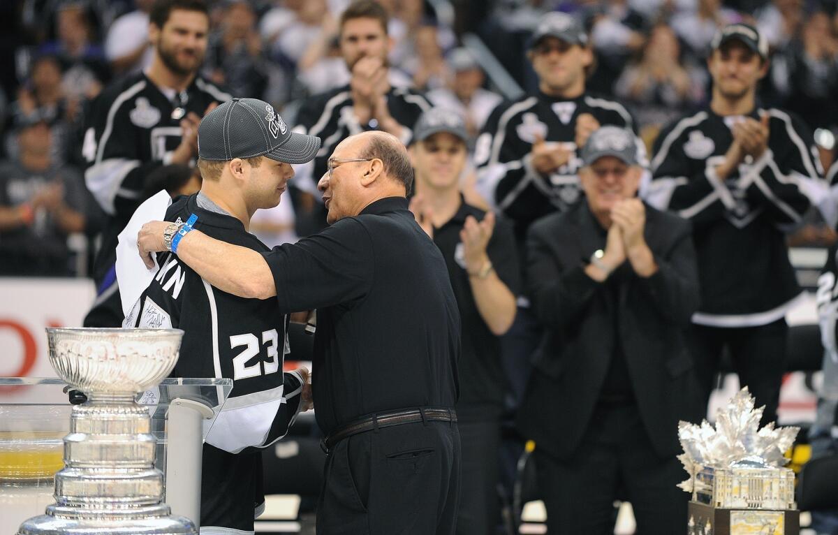 Kings captain Dustin Brown, shown with announcer Bob Miller as the team celebrated its Stanley Cup championship this summer, says the upcoming shortened season will be intense but has its advantages too.