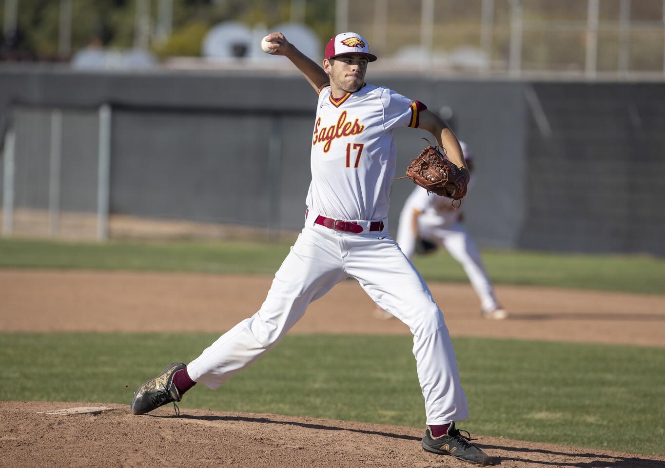 Estancia's Justin Wood throws a complete game against Costa Mesa in an Orange Coast League game on Wednesday.