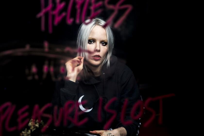 LOS ANGELES, CALIF. - APRIL 19: Singer and songwriter. Alice Glass poses for a portrait at her home in Los Angeles on Thursday, April 19, 2018 in Los Angeles, Calif. The text was written in lipstick on a mirror for a video project Glass did earlier. (Kent Nishimura / Los Angeles Times)