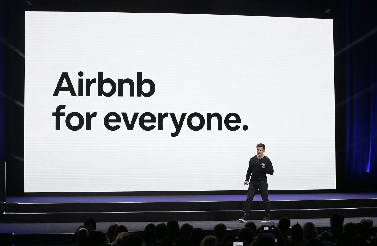 FILE - In this Feb. 22, 2018, file photo, Airbnb co-founder and CEO Brian Chesky speaks during an event in San Francisco. Airbnb hopes to raise as much as $2.6 billion in its initial public stock offering this month, betting investors will see its home-sharing model as the future of travel. In a government filing Tuesday, Dec. 1, 2020, the San Francisco-based company said it expects to offer 51.9 million common shares priced between $44 and $50 per share. (AP Photo/Eric Risberg, File)
