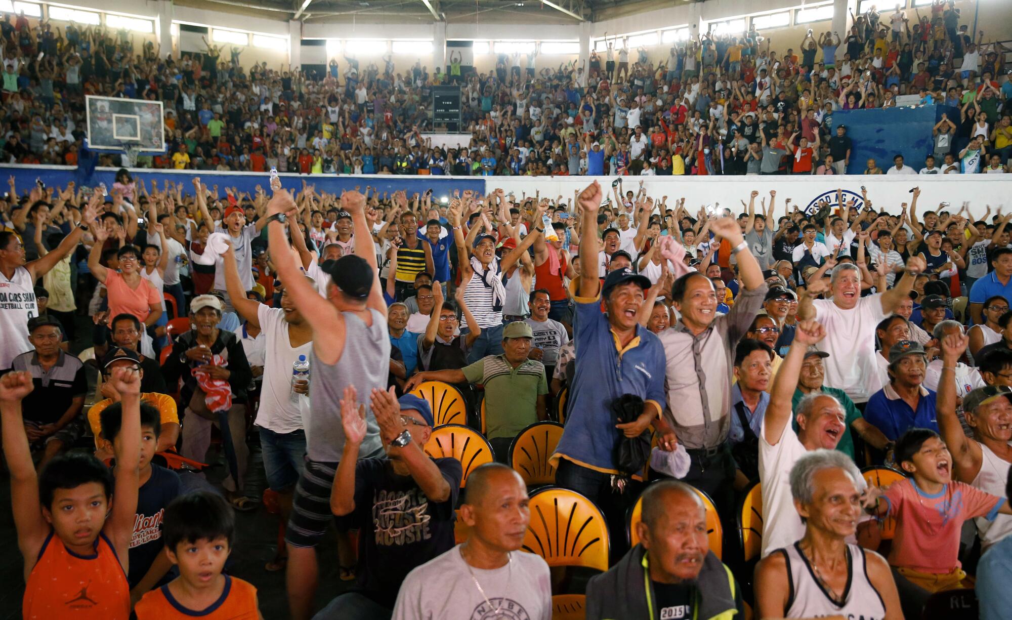 Filipinos in Manila cheer at the announcement that Manny Pacquiao defeated Keith Thurman by split decision.