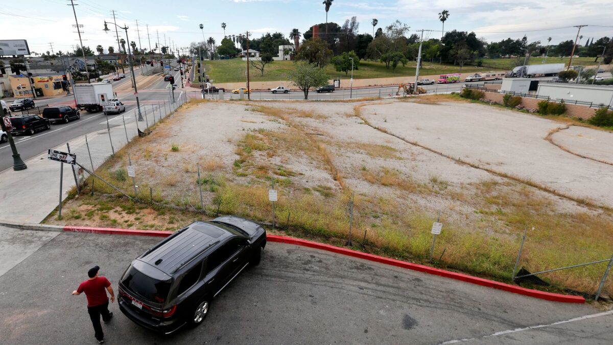 After Councilman Jose Huizar reversed course, the Los Angeles City Council cleared the way Tuesday for construction of a homeless housing project on this lot in Boyle Heights next to the popular El Mercado shopping center.