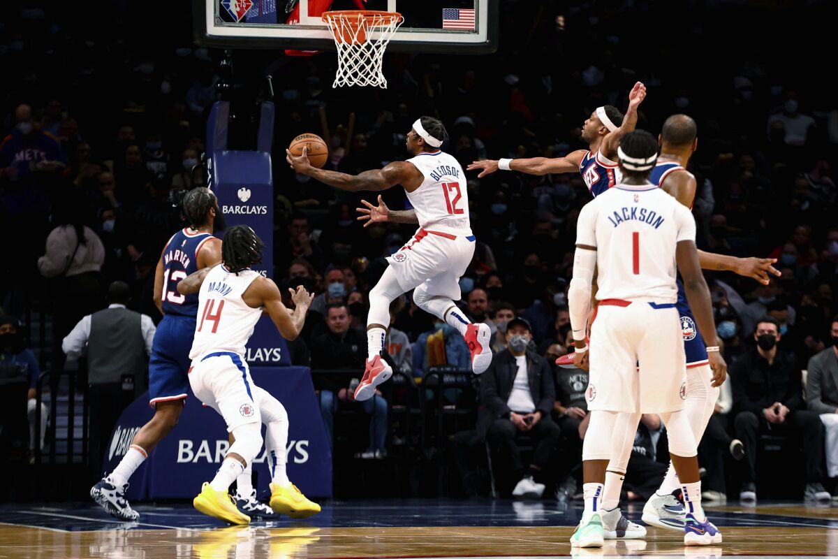 Clippers guard Eric Bledsoe attempts a layup against the Nets.
