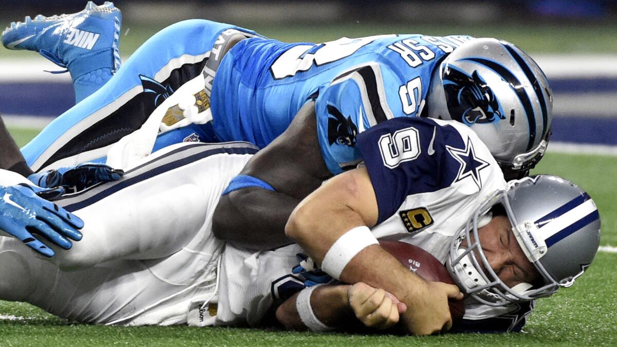 Panthers linebacker Thomas Davis sacks Cowboys quarterback Tony Romo in the second half Thursday. Romo left the game after the play because of an injury.