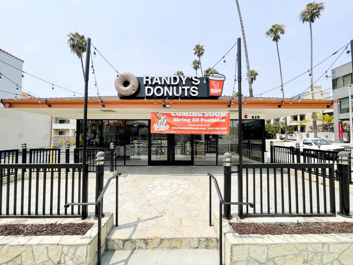 The exterior of a Randy's Donuts shop.