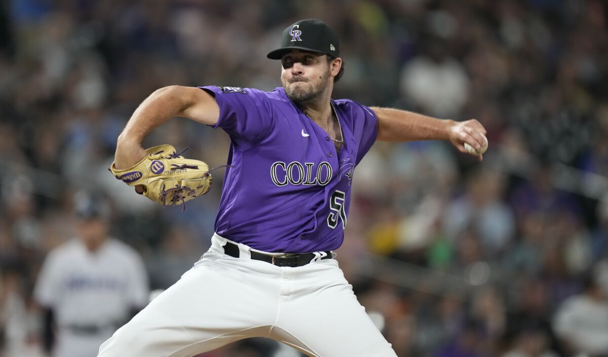 Colorado Rockies relief pitcher Ben Bowden works against the Miami Marlins in the seventh inning of a baseball game Friday, Aug. 6, 2021, in Denver. (AP Photo/David Zalubowski)