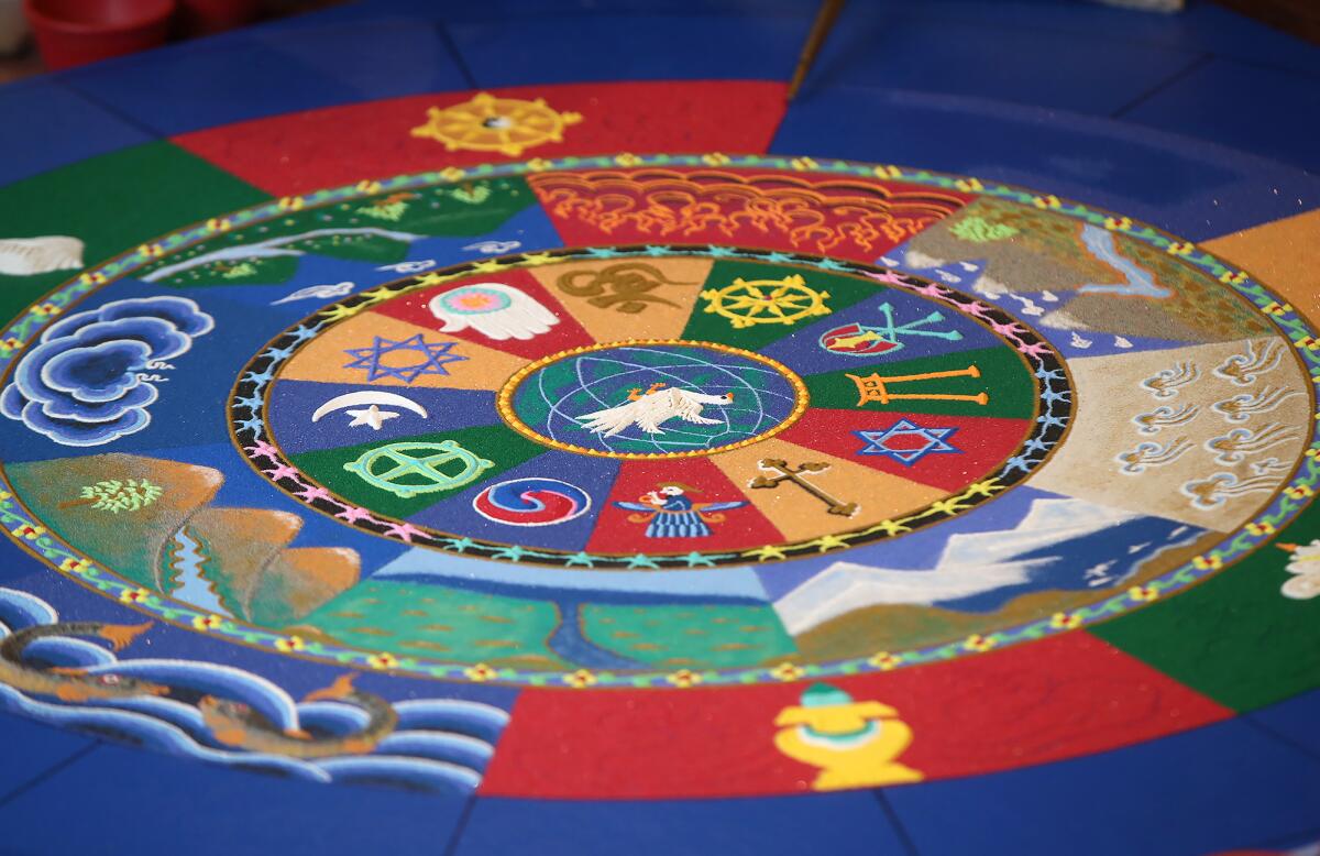 The progress made on a colorful world peace mandala by Drepung Gomang monks as of Friday at the Sawdust Festival.