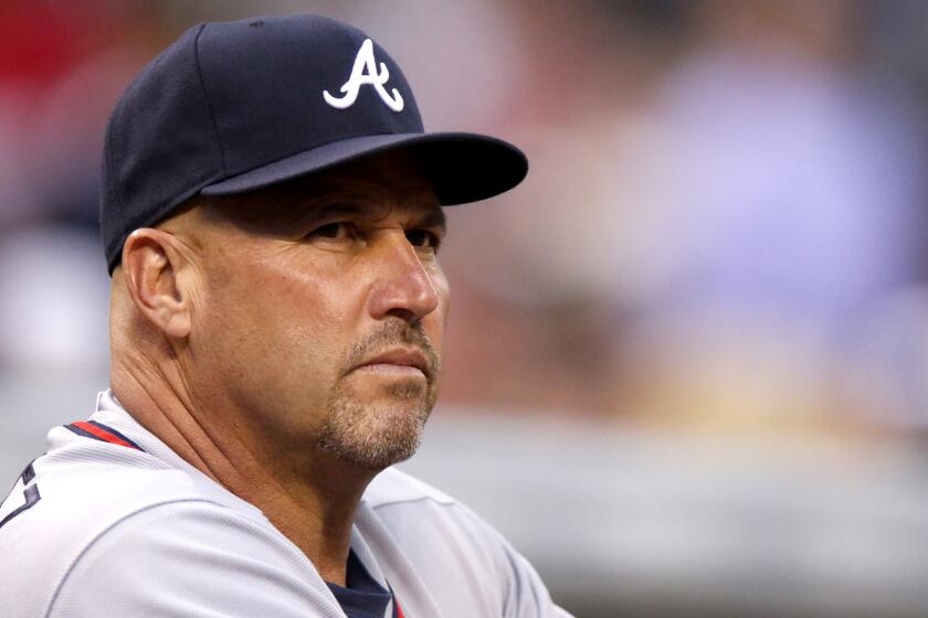 Manager Fredi Gonzalez watches the Braves play the Rockies on July 9 in Denver.