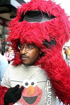 Elmo impersonator Donn Harper was arrested by undercover police for soliciting tips on Hollywood Boulevard.