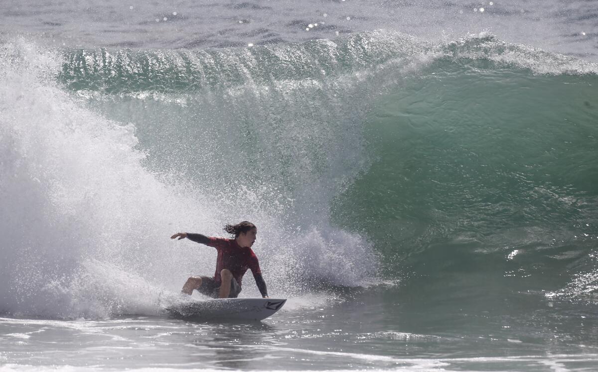 Dante Madrigal of Laguna Beach drops in backside of a well overhead wave.