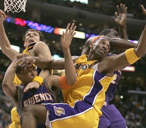 Kobe Bryant battles Shawn Marion and a host of other players for a rebound.