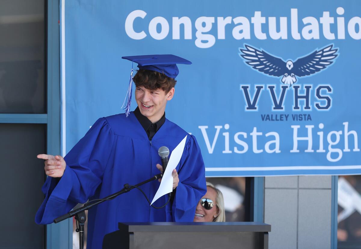 Student speaker Weylin Wertheimer shares a laugh with classmates on Thursday.