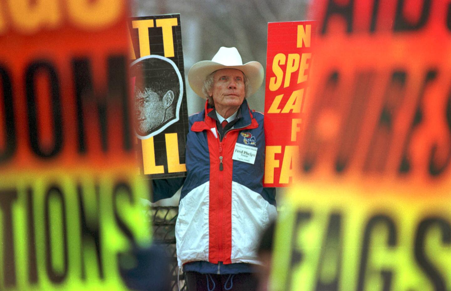 Fred Phelps and members of Westboro Baptist Church demonstrate at the trial of Russell Henderson in the killing of Matthew Shepard.