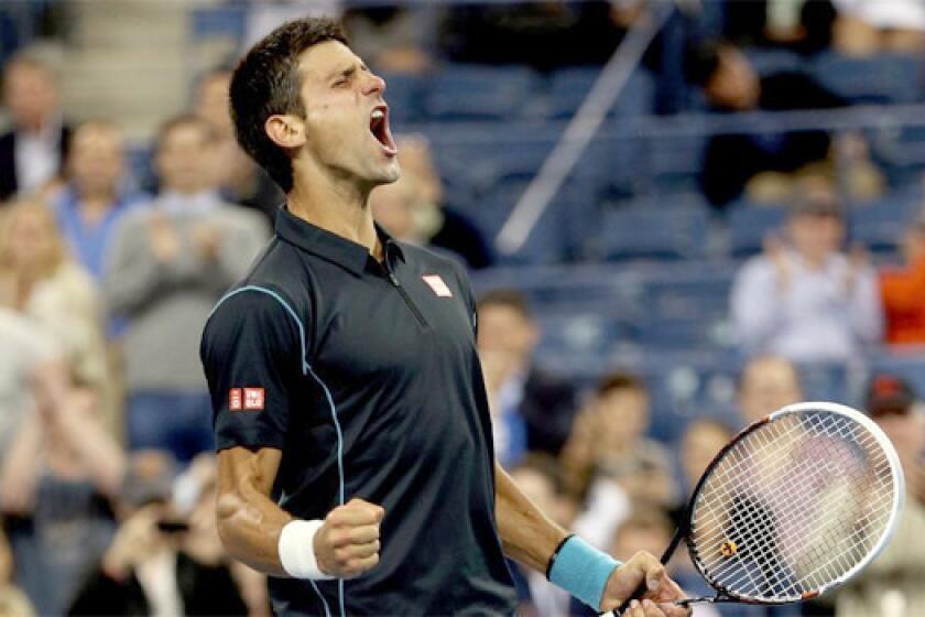 Novak Djokovic celebrates a 6-3, 6-2, 3-6, 6-0 victory over Mikhail Youzhny in a quarterfinal matchup at the U.S. Open.