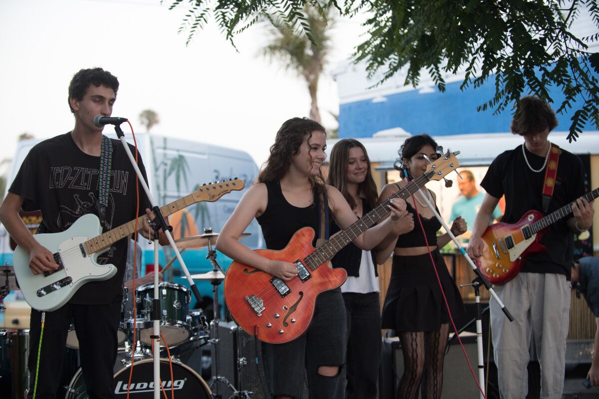 Kiara Blacher performing with the band Vixi at the July 10 benefit concert.