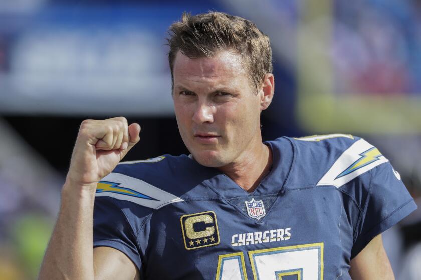 ORCHARD PARK, NEW YORK, SUNDAY, SEPTEMBER 16, 2018 - Chargers quarterback Philip Rivers shows a clenched fist to a handful of fans as the end of a 31-20 LA win over the Buffalo Bills approaches at New Era Field. (Robert Gauthier/Los Angeles Times)