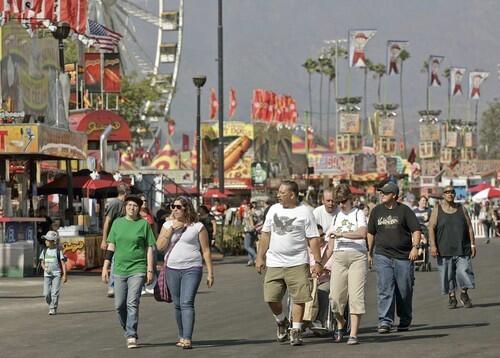 Patrons of the L.A. County Fair stroll past the many concession offerings.