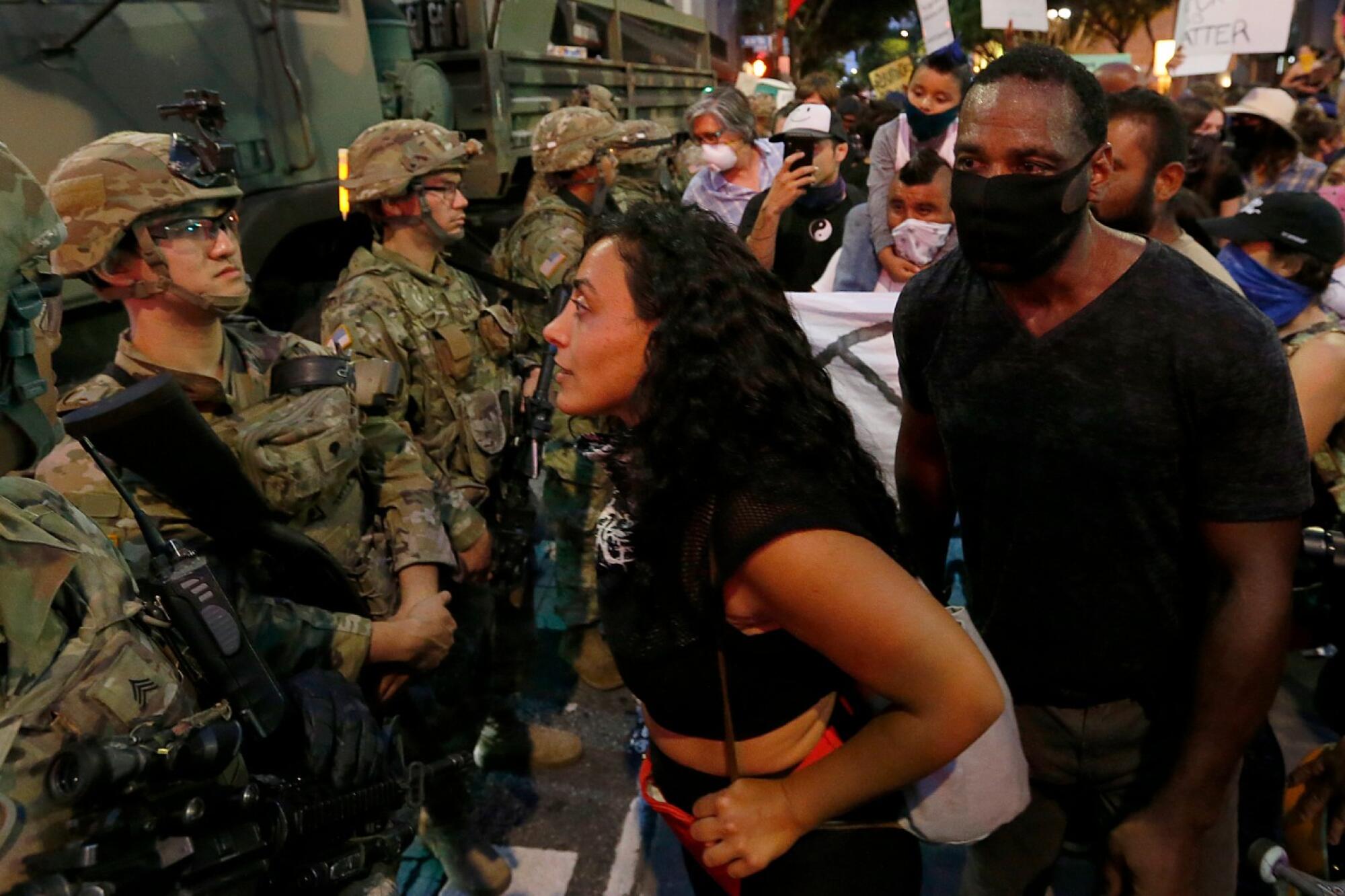 Protesters confront National Guardsmen in downtown Los Angeles