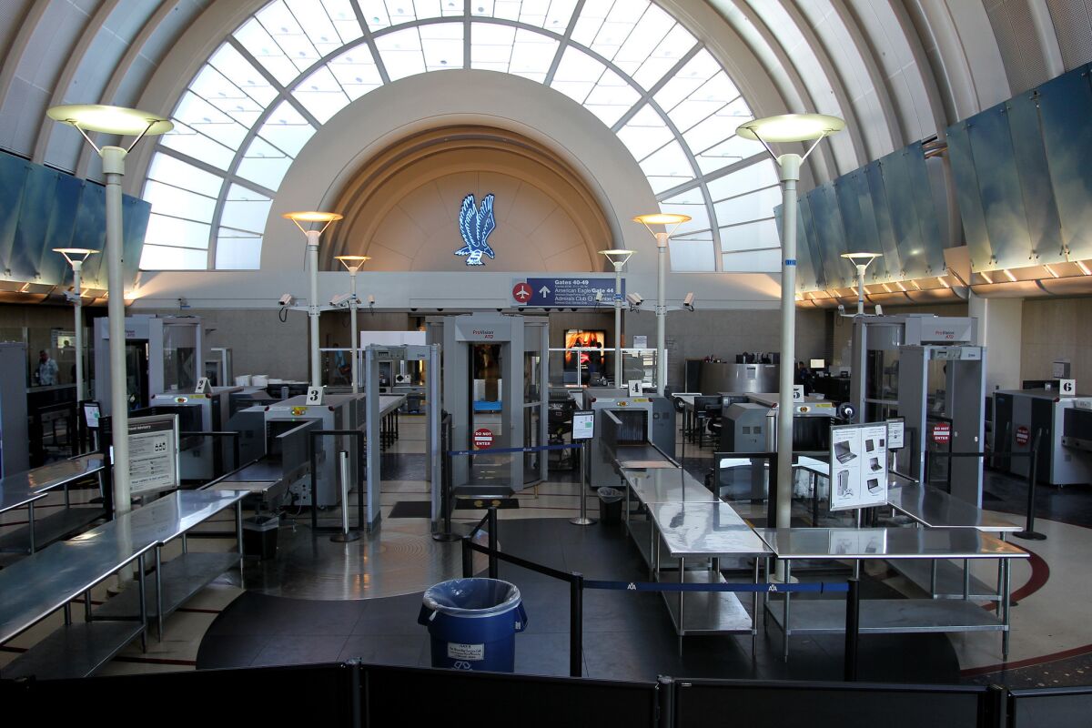 A security screening area stands idle at Tom Bradley International Terminal at Los Angles International Airport.