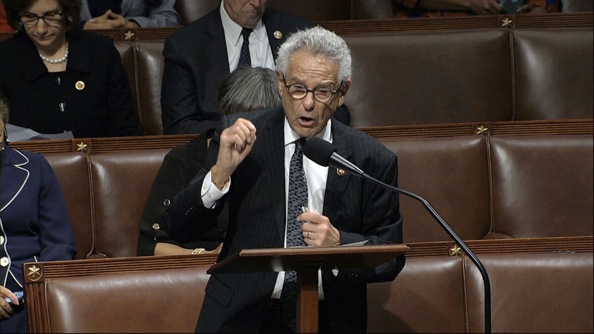 Rep. Alan Lowenthal (D-Long Beach) speaks at a lectern on the House floor