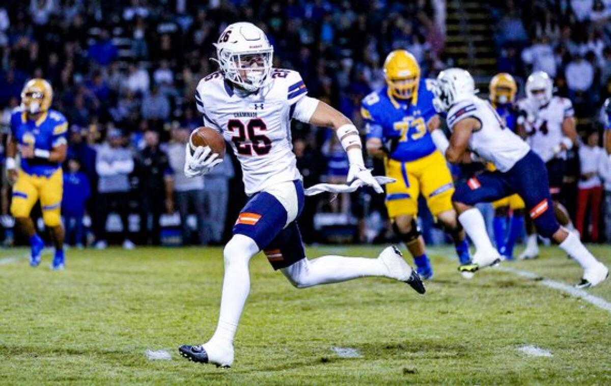 Ryan Abughazaleh of Chaminade heads to end zone on his way to 30-yard interception return for touchdown against Bishop Amat.