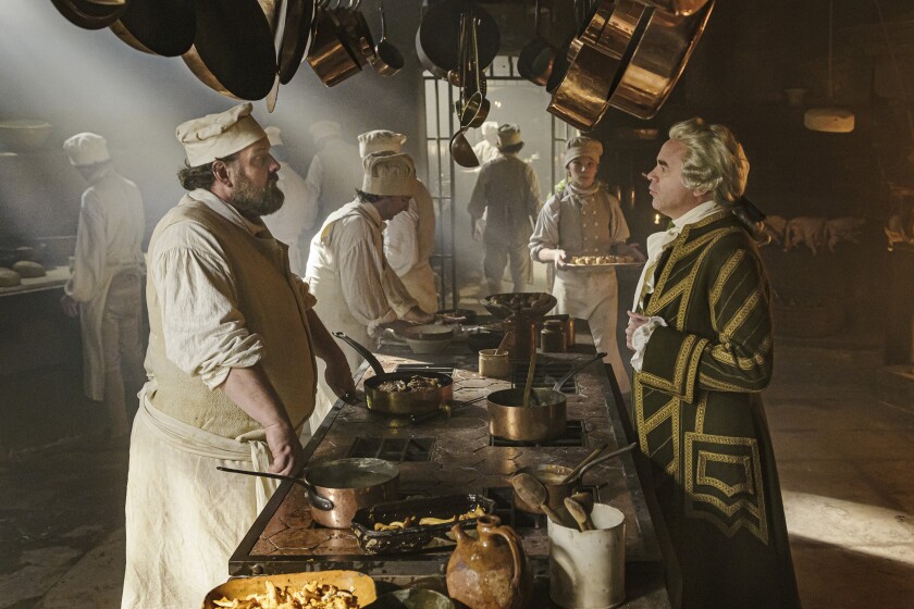 A chef and a steward face off in an 18th century kitchen in the movie “Delicious.”