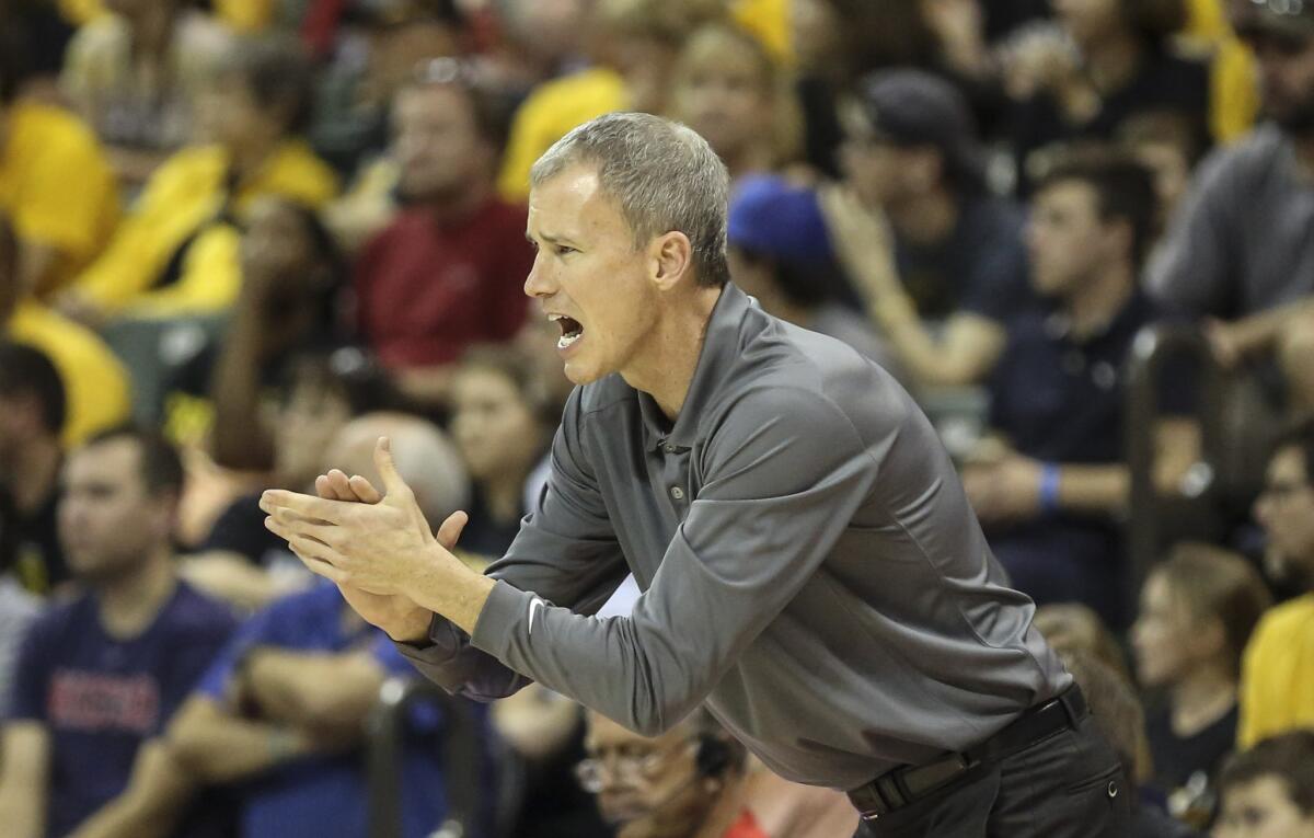 USC Coach Andy Enfield instructs the Trojans against Wichita State on Nov. 26, 2015.