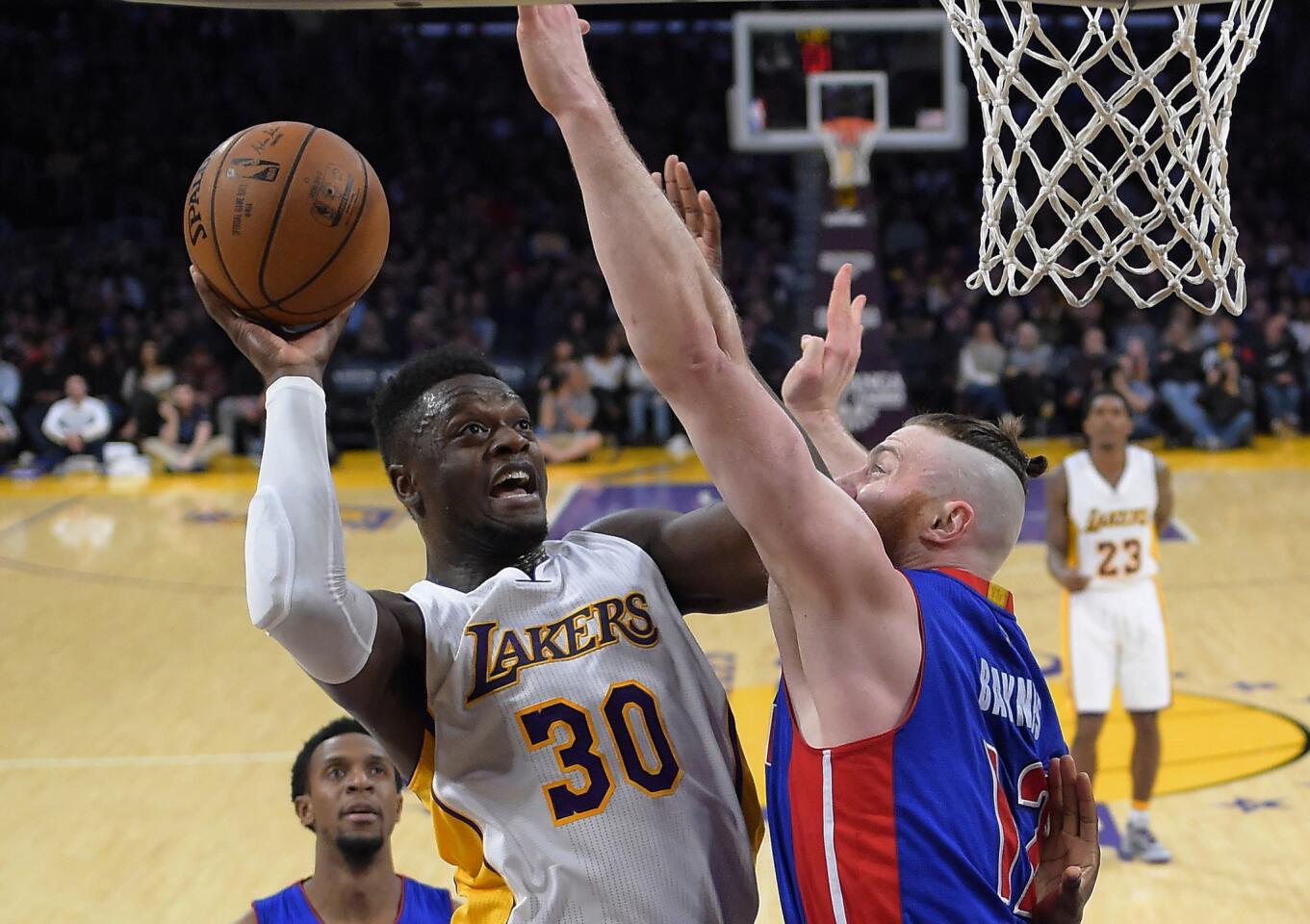 Lakers forward Julius Randle (30) has his shot challenged by Pistons center Aron Baynes during the first half.
