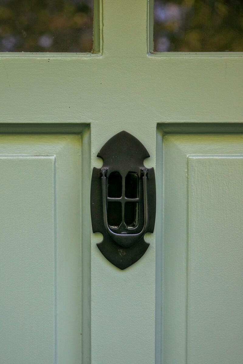 A close-up of the knocker on the front door of the Ivanhoe Vista home.