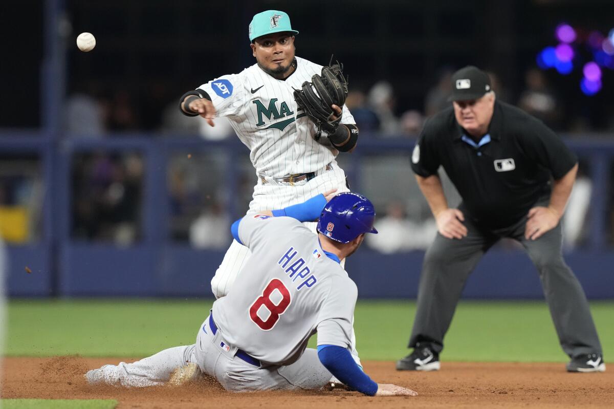 Joey Wendle of the Miami Marlins throws to first base against the