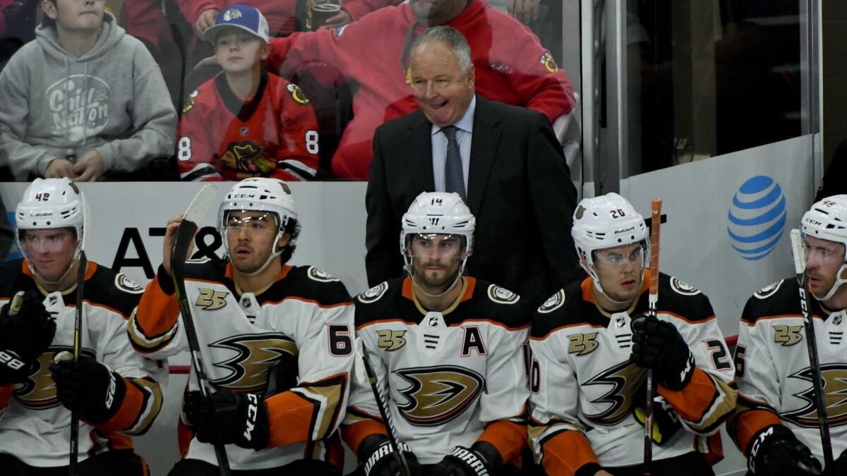 Ducks coach Randy Carlyle and the Ducks lost their third in as row Tuesday night in Chicago.