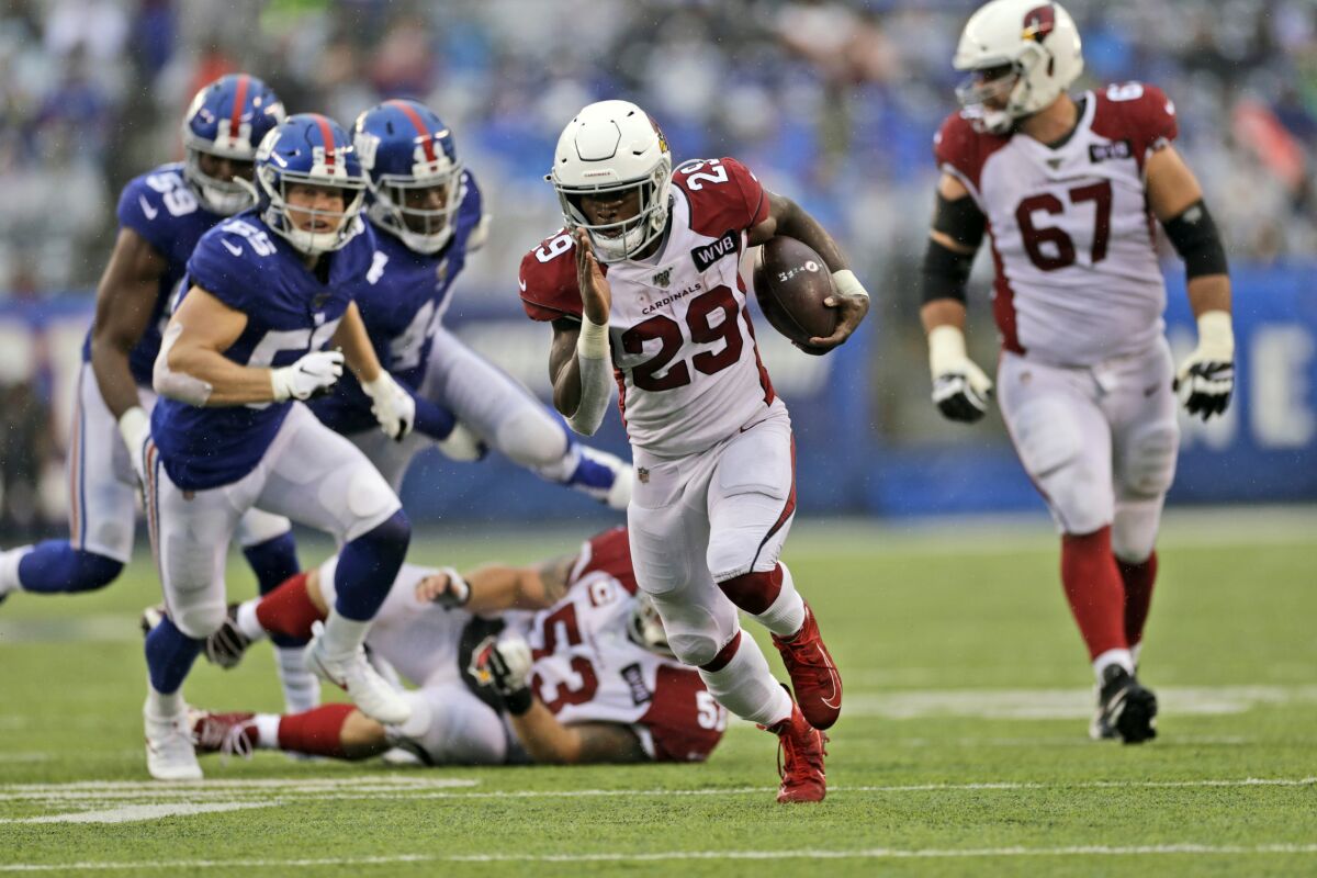 Arizona's Chase Edmonds runs for one of his three touchdowns Sunday against the New York Giants.