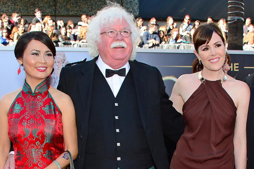 Ron MacFarlane, father of Seth MacFarlane, his wife Xiao Xiang, left, and Seth's sister Rachael MacFarlane, right, arrive on the red carpet for the 85th Academy Awards