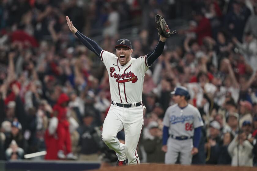 Atlanta Braves first baseman Freddie Freeman celebrates after winning Game 6 of baseball's National League Championship Series against the Los Angeles Dodgers Sunday, Oct. 24, 2021, in Atlanta. The Braves defeated the Dodgers 4-2 to win the series. (AP Photo/Brynn Anderson)