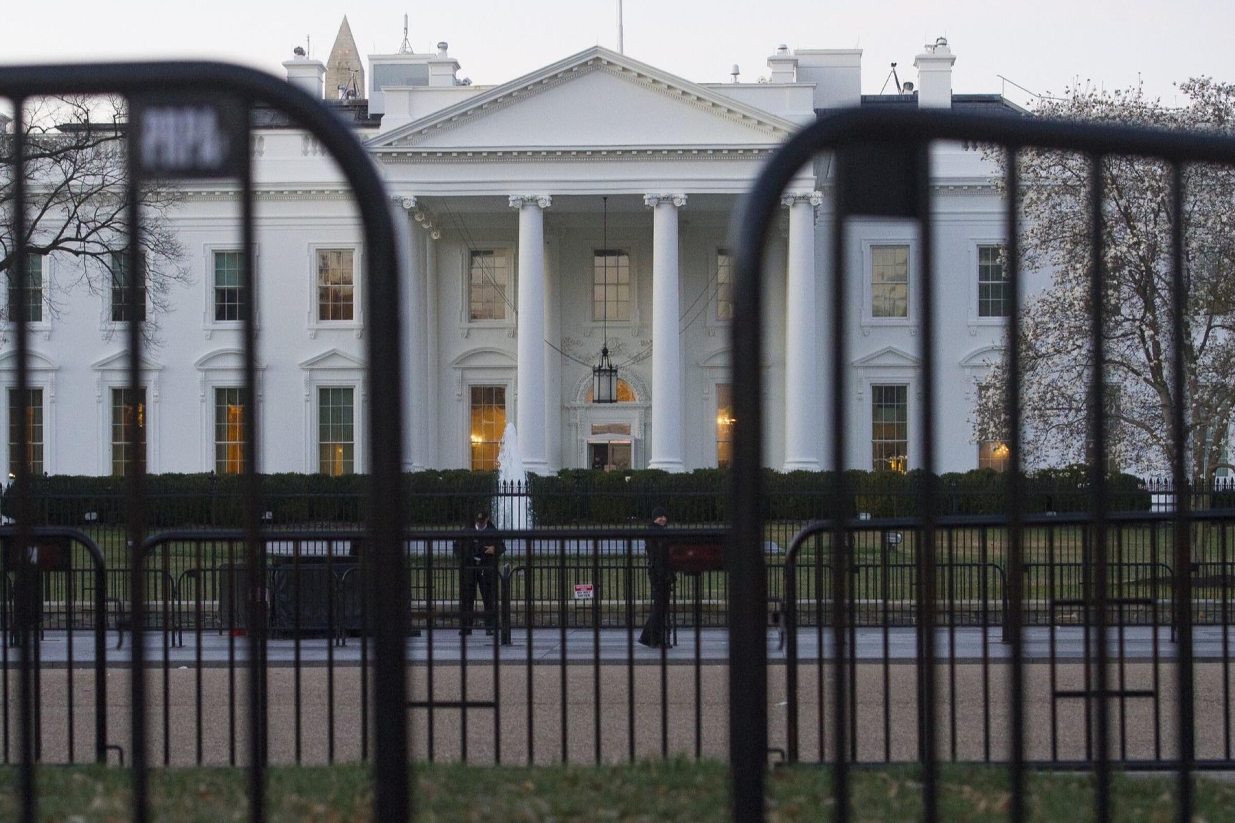 The White House behind security barriers.